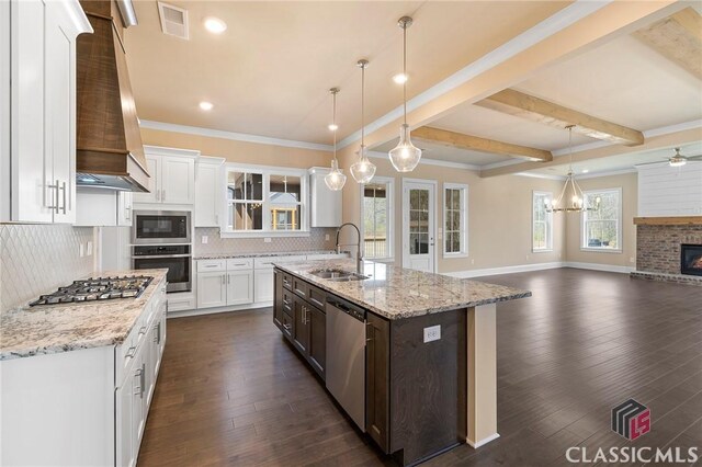 1745 Silo Bnd Unit 16, Watkinsville, GA 30677 - kitchen with premium range hood, dark wood finished floors, decorative backsplash, stainless steel appliances, and a sink