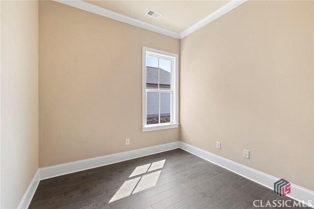 1745 Silo Bnd Unit 16, Watkinsville, GA 30677 - spare room with visible vents, baseboards, dark wood finished floors, and ornamental molding