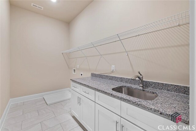 1745 Silo Bnd Unit 16, Watkinsville, GA 30677 - laundry area featuring visible vents, washer hookup, a sink, cabinet space, and hookup for an electric dryer