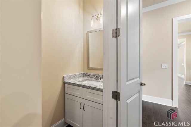 1745 Silo Bnd Unit 16, Watkinsville, GA 30677 - bathroom with vanity, baseboards, and wood finished floors