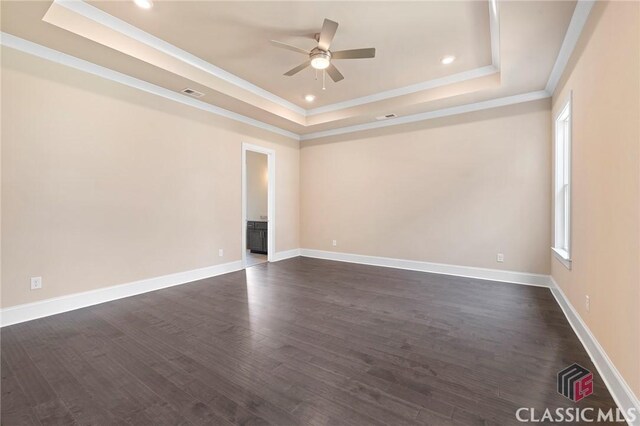 1745 Silo Bnd Unit 16, Watkinsville, GA 30677 - spare room featuring visible vents, dark wood-type flooring, ceiling fan, ornamental molding, and a raised ceiling