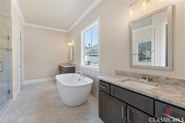 1745 Silo Bnd Unit 16, Watkinsville, GA 30677 - full bathroom featuring two vanities, a freestanding bath, ornamental molding, a shower stall, and a sink