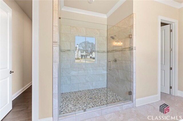 1745 Silo Bnd Unit 16, Watkinsville, GA 30677 - bathroom featuring a shower stall, wood finished floors, crown molding, and baseboards