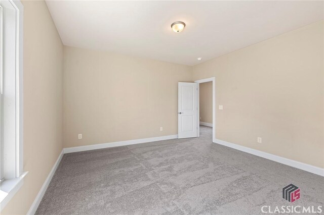 1745 Silo Bnd Unit 16, Watkinsville, GA 30677 - unfurnished room with baseboards and carpet flooring