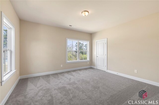 1745 Silo Bnd Unit 16, Watkinsville, GA 30677 - unfurnished room with baseboards, visible vents, and carpet floors