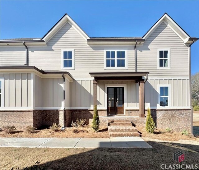 1745 Silo Bnd Unit 16, Watkinsville, GA 30677 - view of front of home with brick siding, french doors, and board and batten siding