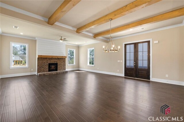 1745 Silo Bnd Unit 16, Watkinsville, GA 30677 - unfurnished living room with beamed ceiling, visible vents, dark wood finished floors, a brick fireplace, and ceiling fan with notable chandelier