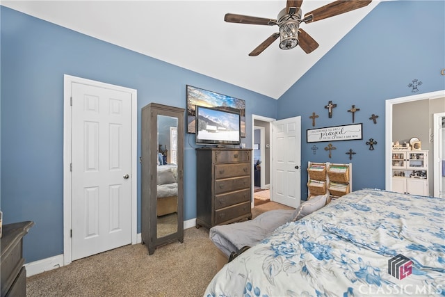 carpeted bedroom with ceiling fan and high vaulted ceiling