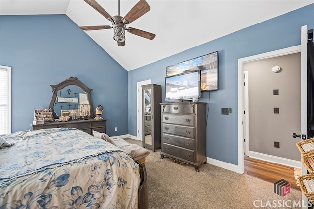 carpeted bedroom with ceiling fan and lofted ceiling