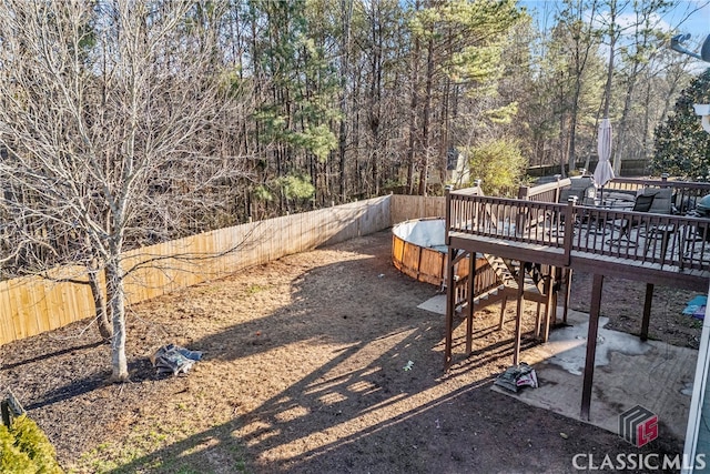 view of yard featuring a wooden deck