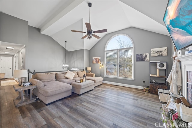 living room featuring hardwood / wood-style flooring, ceiling fan, lofted ceiling, and a fireplace