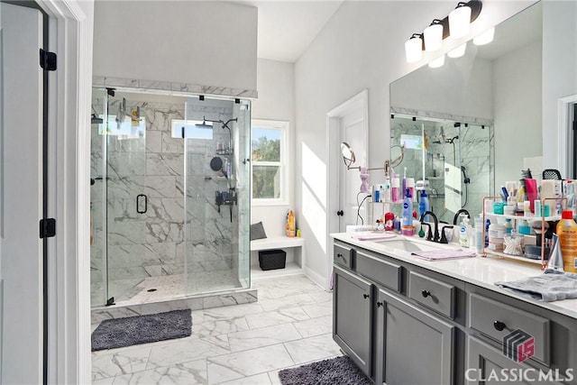 bathroom featuring vanity and a shower with door