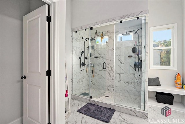 bathroom featuring a shower with door