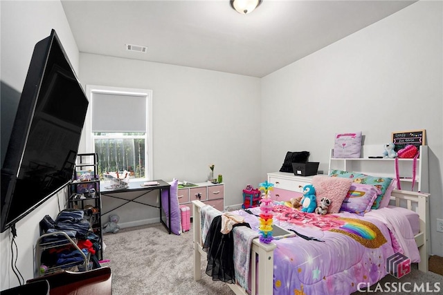 bedroom featuring light carpet