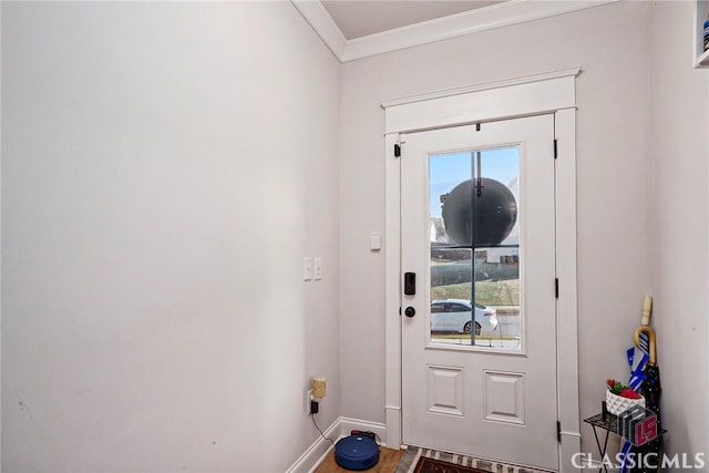 doorway to outside with crown molding and wood-type flooring