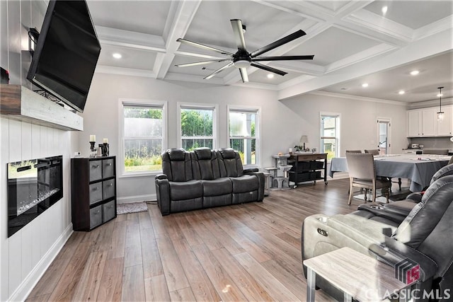 living room with beam ceiling, ceiling fan, coffered ceiling, light hardwood / wood-style floors, and a fireplace