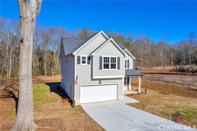 view of front of home with a garage and a front yard