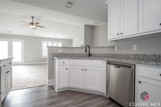 kitchen featuring light stone countertops, sink, ceiling fan, stainless steel dishwasher, and white cabinets