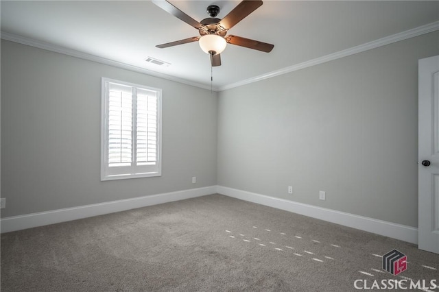 carpeted empty room with ceiling fan and ornamental molding