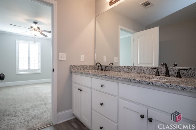 bathroom with ceiling fan and vanity