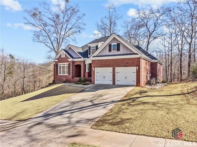 craftsman inspired home with a garage and a front lawn