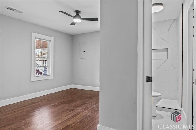 interior space with ceiling fan and dark wood-type flooring