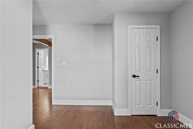 hallway featuring dark hardwood / wood-style floors