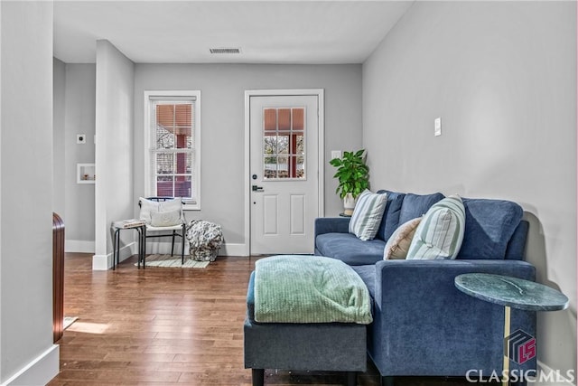 living room featuring dark hardwood / wood-style floors