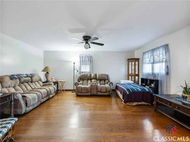 bedroom featuring hardwood / wood-style floors and ceiling fan