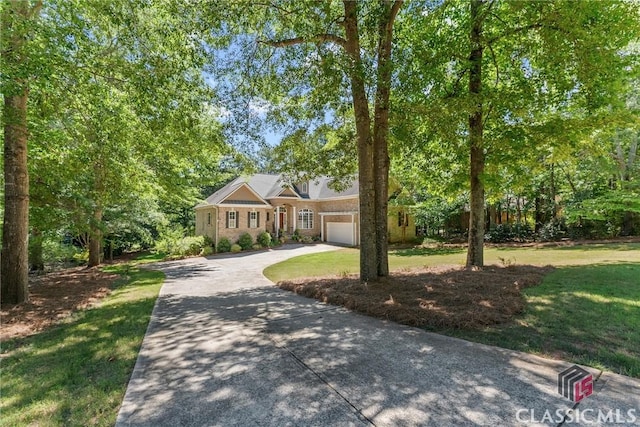 view of front of home featuring a garage and a front lawn