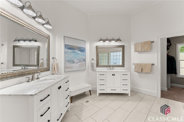 bathroom with tile patterned flooring and vanity