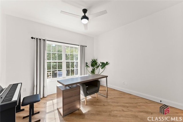 office area with ceiling fan and light hardwood / wood-style flooring