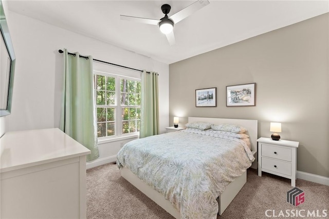 bedroom with light carpet and ceiling fan