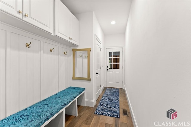 mudroom with light hardwood / wood-style floors