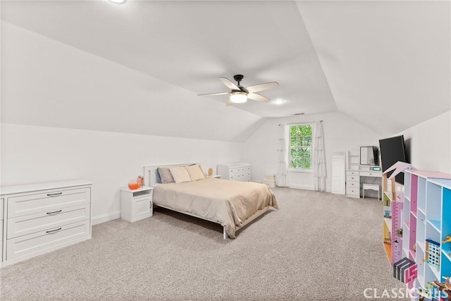 bedroom with ceiling fan, light colored carpet, and lofted ceiling