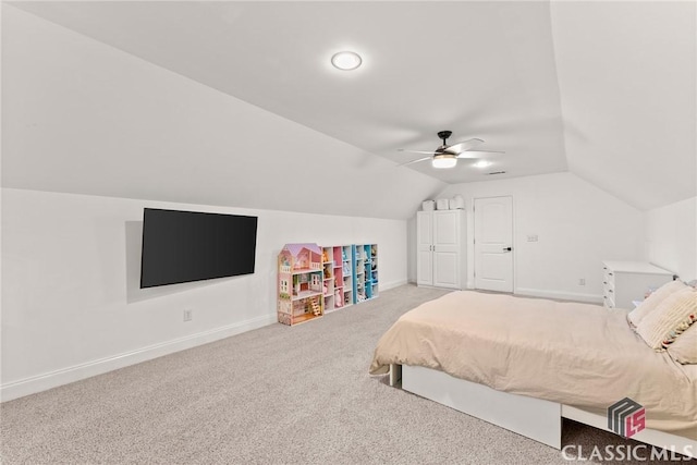 carpeted bedroom featuring vaulted ceiling and ceiling fan