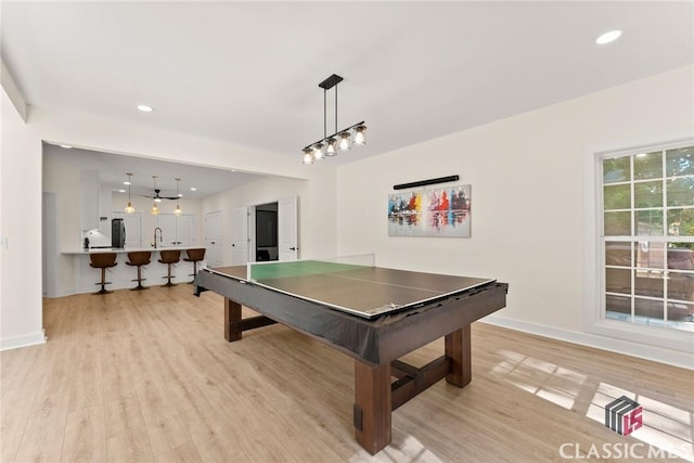 playroom featuring light hardwood / wood-style flooring and sink