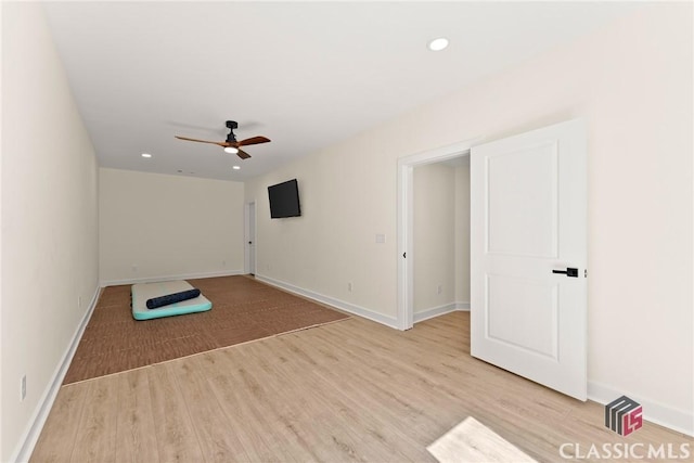 interior space with ceiling fan and light hardwood / wood-style floors