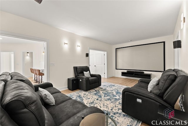 home theater room featuring light hardwood / wood-style flooring