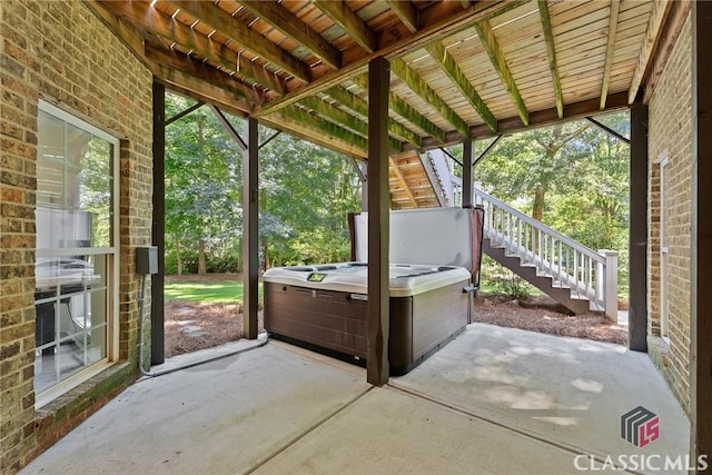 view of patio / terrace featuring a hot tub