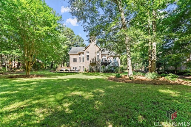 view of yard featuring a wooden deck