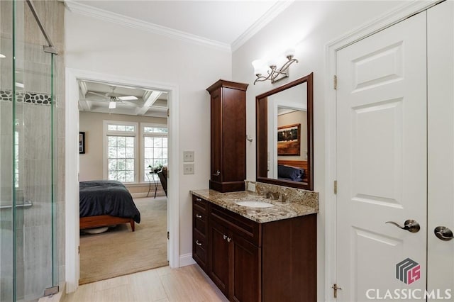 bathroom with vanity, coffered ceiling, crown molding, ceiling fan, and beamed ceiling