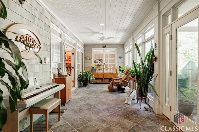 sunroom with french doors and ceiling fan