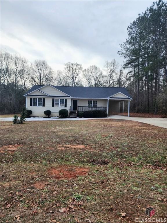 ranch-style house featuring a carport and a porch