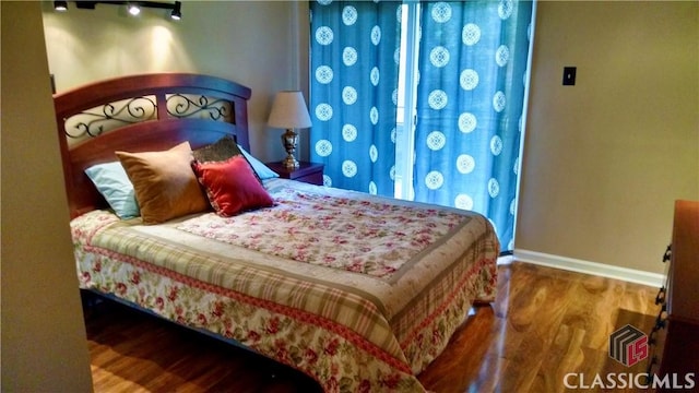 bedroom featuring hardwood / wood-style floors