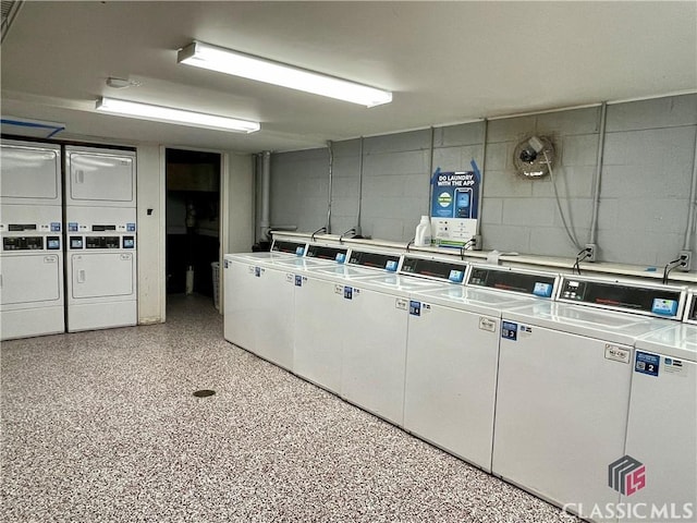 laundry room featuring stacked washer and clothes dryer and independent washer and dryer