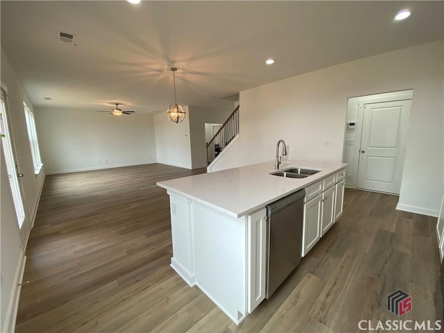 kitchen with white cabinets, a kitchen island with sink, sink, wood-type flooring, and dishwasher