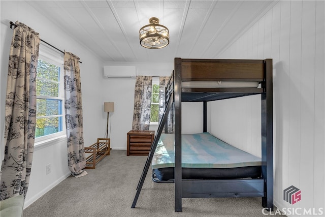 unfurnished bedroom featuring a wall unit AC and carpet