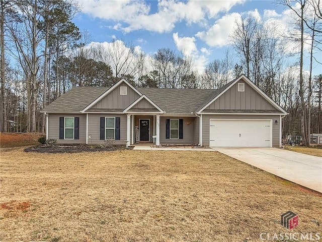 view of front of home with a garage and a front yard