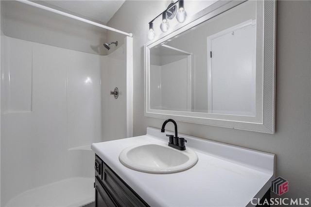 bathroom featuring vanity and walk in shower